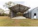 Open-air metal shed with concrete floor at 12359 Ne Highway 314, Silver Springs, FL 34488