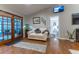 Common area features a couch, a fish tank and access to the back yard at 12359 Ne Highway 314, Silver Springs, FL 34488