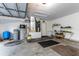 Spacious garage with storage and work bench at 12359 Ne Highway 314, Silver Springs, FL 34488