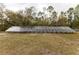 Long row of solar panels in a grassy field at 12359 Ne Highway 314, Silver Springs, FL 34488