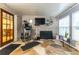 Sunroom with flagstone flooring and brick wall at 12359 Ne Highway 314, Silver Springs, FL 34488