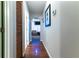 Bright hallway with wood flooring leading to other rooms at 12359 Ne Highway 314, Silver Springs, FL 34488