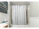 Clean bathroom with shower/tub combo and patterned curtain at 12359 Ne Highway 314, Silver Springs, FL 34488