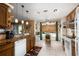 Kitchen boasts granite countertops and ample cabinetry at 5 Hemlock Terrace Pass, Ocala, FL 34472
