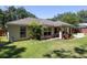 House exterior with backyard, landscaping, and patio at 5 Hemlock Terrace Pass, Ocala, FL 34472