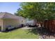 Large backyard with grassy area, trees, and camper at 5 Hemlock Terrace Pass, Ocala, FL 34472