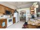 Open kitchen with granite counters and stainless steel appliances at 5 Hemlock Terrace Pass, Ocala, FL 34472