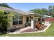 House exterior showcasing backyard patio and landscaping at 5 Hemlock Terrace Pass, Ocala, FL 34472
