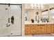 Bathroom with a large walk-in shower and light wood vanity at 8033 Sw 81St Loop, Ocala, FL 34476