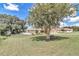 House with a spacious yard and large tree at 326 Oak Lane Dr, Ocala, FL 34472