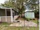 Home features a screened porch and patio area at 14468 Ne 204Th Ln, Fort Mc Coy, FL 32134