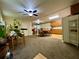 Open floor plan with adjacent kitchen and dining area at 14468 Ne 204Th Ln, Fort Mc Coy, FL 32134