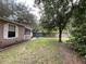 Side view of house with fenced backyard at 14468 Ne 204Th Ln, Fort Mc Coy, FL 32134