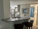 Modern kitchen with granite countertops and stainless steel appliances at 2625 S Atlantic Ave # 9Ne, Daytona Beach, FL 32118