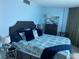 Comfortable bedroom with a queen-size bed and ocean decor at 2625 S Atlantic Ave # 9Ne, Daytona Beach, FL 32118