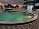 Relaxing community pool area with lounge chairs at 2625 S Atlantic Ave # 9Ne, Daytona Beach, FL 32118