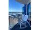 Relaxing ocean view from balcony with white rocking chair at 2625 S Atlantic Ave # 9Ne, Daytona Beach, FL 32118
