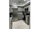 Modern kitchen featuring stainless steel appliances and granite countertops at 2625 S Atlantic Ave # 9Ne, Daytona Beach, FL 32118