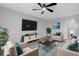 Bright living room featuring comfy seating, a large TV, and stylish decor at 600 Bahia Cir # A, Ocala, FL 34472