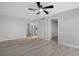 Living room with wood-look floors and ceiling fan at 600 Bahia Cir # A, Ocala, FL 34472