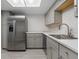 Modern kitchen with stainless steel appliances and gray cabinets at 600 Bahia Cir # A, Ocala, FL 34472