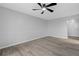Living room with wood-look floors and ceiling fan at 600 Bahia Cir # A, Ocala, FL 34472