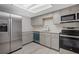 Modern kitchen with stainless steel appliances and gray cabinets at 600 Bahia Cir # A, Ocala, FL 34472