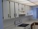 White cabinets and overhead lighting at 89 S Atlantic Ave # 204, Ormond Beach, FL 32176