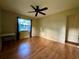 Simple bedroom with wood flooring and a window for natural light at 19831 Sw Nightingale Dr, Dunnellon, FL 34431