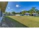 Spacious backyard with large grassy area and privacy fence at 3290 Se 53Rd Ct, Ocala, FL 34480