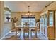 Bright dining room featuring a chandelier and built-in hutch at 3290 Se 53Rd Ct, Ocala, FL 34480