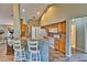 Kitchen features light wood cabinets, tile flooring and breakfast bar at 3290 Se 53Rd Ct, Ocala, FL 34480