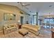 Open concept living room with hardwood floors and views into the dining area at 3290 Se 53Rd Ct, Ocala, FL 34480