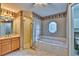 Main bathroom with a large garden tub and shower at 3290 Se 53Rd Ct, Ocala, FL 34480