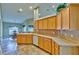 Bright kitchen with light wood cabinets and an adjacent dining area at 3290 Se 53Rd Ct, Ocala, FL 34480