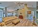 Open concept living area with hardwood floors, and built-in cabinetry at 3290 Se 53Rd Ct, Ocala, FL 34480