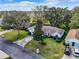 Aerial view of a single-Gathering home with a well-maintained lawn and driveway at 9573 Sw 53Rd Cir, Ocala, FL 34476