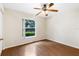 Bright bedroom featuring wood-look floors at 9573 Sw 53Rd Cir, Ocala, FL 34476