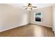 Well-lit bedroom featuring hardwood floors and a window at 9573 Sw 53Rd Cir, Ocala, FL 34476