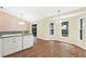 Eat-in kitchen with bay window and laminate flooring at 9573 Sw 53Rd Cir, Ocala, FL 34476