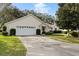 House exterior showcasing a two-car garage and driveway at 9573 Sw 53Rd Cir, Ocala, FL 34476