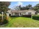 Single-story home with landscaped yard at 9573 Sw 53Rd Cir, Ocala, FL 34476