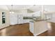 Well-equipped kitchen featuring white cabinetry and laminate floors at 9573 Sw 53Rd Cir, Ocala, FL 34476