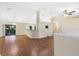 Open living area with laminate floors and vaulted ceilings at 9573 Sw 53Rd Cir, Ocala, FL 34476