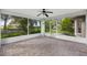 Spacious screened porch with tile flooring and tranquil backyard view at 9573 Sw 53Rd Cir, Ocala, FL 34476