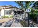 House exterior showcasing a screened porch and walkway at 12 Lakepoint Cir, Port Orange, FL 32128