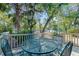 Relaxing patio with a metal table and chairs, perfect for outdoor dining at 12 Lakepoint Cir, Port Orange, FL 32128