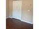 White double-door closet with wood flooring at 14574 Sw 61St Ct, Ocala, FL 34473