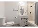 Modern bathroom with marble shower, white vanity, and gray floors at 21854 Nw 60Th Ave, Micanopy, FL 32667