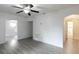 Bright living room with gray vinyl flooring and ceiling fan at 21854 Nw 60Th Ave, Micanopy, FL 32667